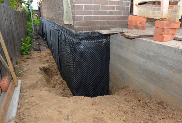 Happy homeowners after waterproofing job in Beach Haven